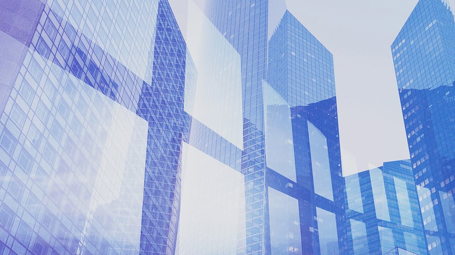High-rise office building shot in a double exposure so it looks like the Windows logo is overlaid on the buildings.