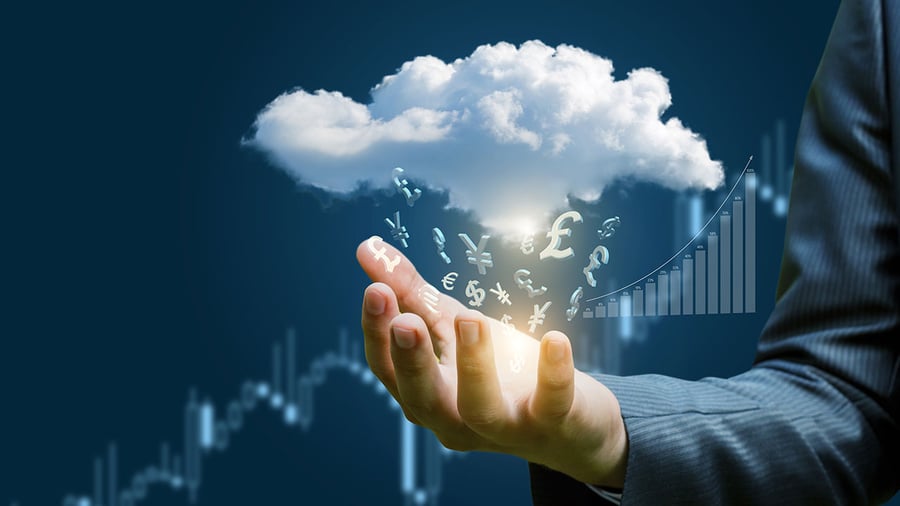 Arm of a business person in a suit reaching into the foreground with palm extended while a storm cloud hovers over their hand and it's raining currency symbols from around the globe